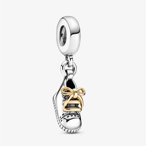 Pandora silver and 14K gold baby shoe dangle